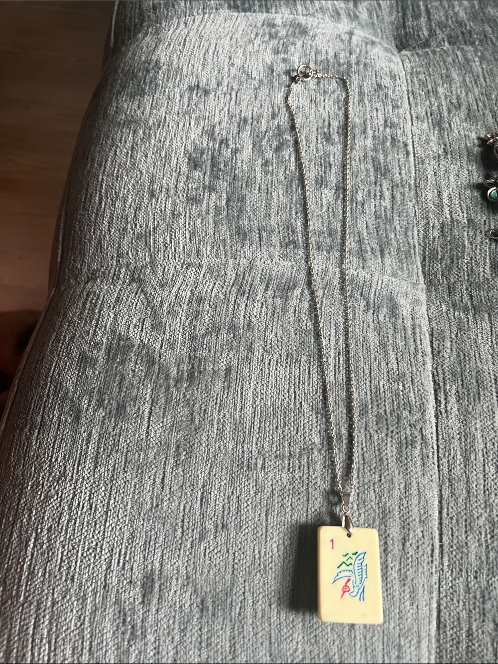 Ivory color Mahjong Tile Pendant Necklace with Silver Chain. Other side has a be